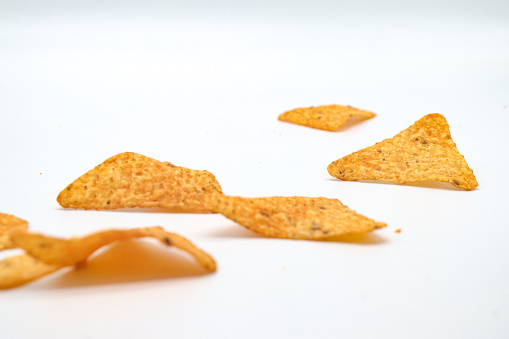 nachos chips isolated on white background. doritos triangle