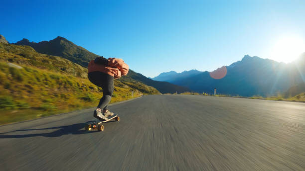istock Woman doing downhill with longboard 1455292363
