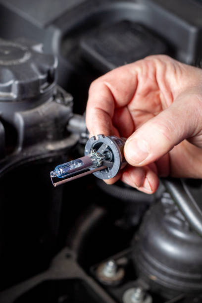 istock A mechanic is holding a bi-xenon headlamp 1455292383