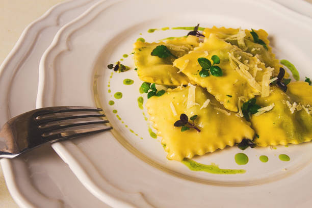 istock Ravioli with spinach and cheese, green sauce, on a light background, selective focus, no people, 1455292394