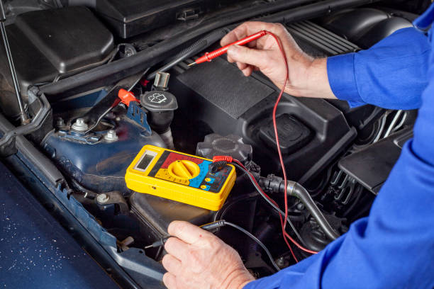 istock Mechanic is testing the battery of a car 1455292625