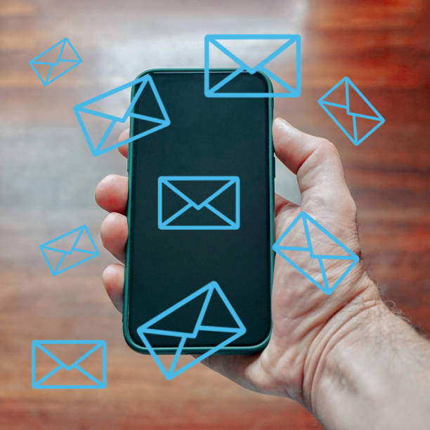 istock hand holding a mobile phone with email simbol, Telecommuting and e-work 1455293503