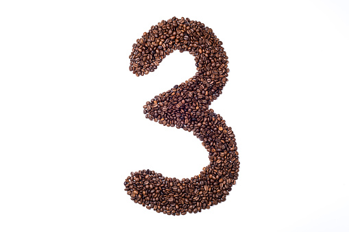 Number made with coffee beans on white background. Number 3  three made of coffee. Coffee number 3 three isolated on white