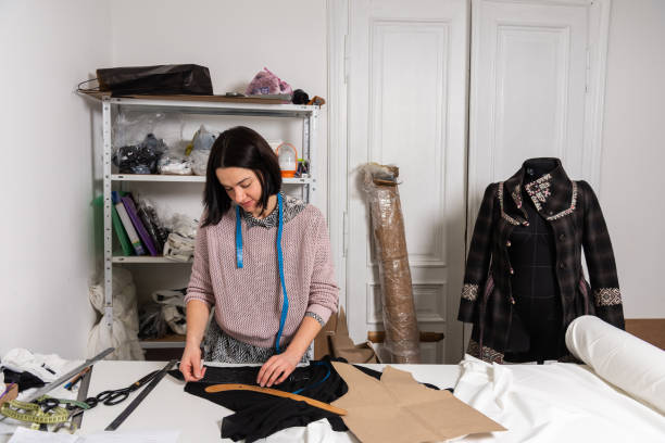 istock Seamstress works in the tailoring workshop 1455294425