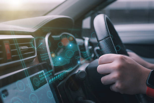 a futuristic vehicle and a graphic user interface (GUI). connected, intelligent vehicles Internet of Things heading-up display (HUD) stock photo