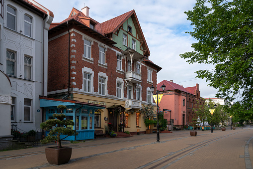 Zelenogradsk, Kaliningrad region, Russia, 08.07.2022: Tourist street in the historical center of the Baltic sea resort Zelenogradsk - Kurortny Prospekt on a summer morning