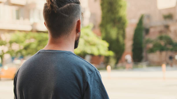 istock Young man with beard stands on crosswalk 1455299762