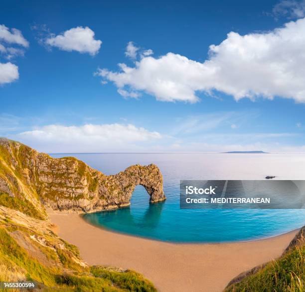 Durdle Door Is A Natural Limestone Arch On The Jurassic Coast In Dorset Beach England Stock Photo - Download Image Now