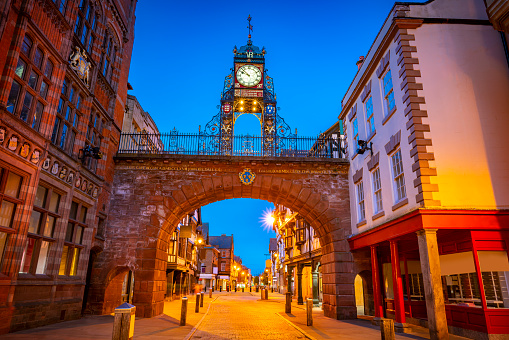 Chester Eastgate clock tower arch at sunset dusk in England UK United Kingdom. Is an open gate from the roman fortress