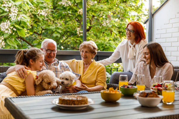 istock Multi-generation family having bonding moments during a celebration on the balcony 1455302337