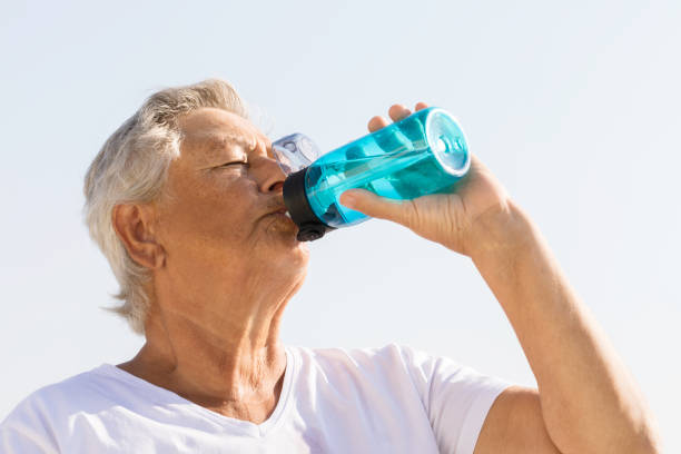 istock Senior woman drinking water 1455302547