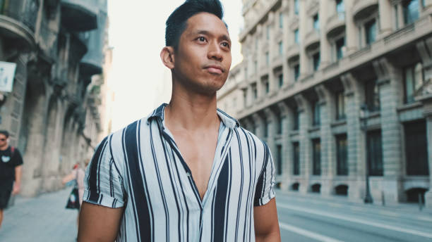 istock Young man standing next to the road 1455303230
