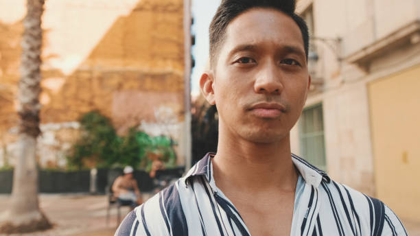 istock Close up, young man looking at the camera and smiling 1455303281