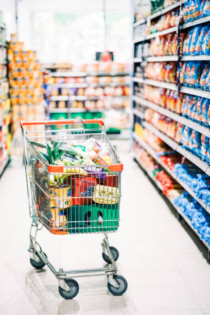 istock Full shopping cart in grocery store 1455304116