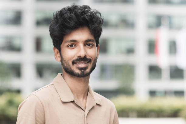 istock Portrait of handsome smiling young man looking at camera 1455305096