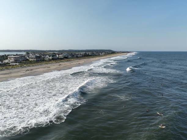 istock Surfing at the new jersey shore during dusk and during the day 1455305121