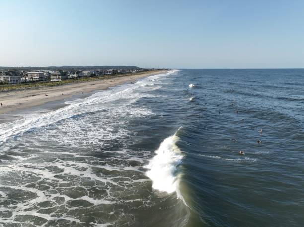 istock Surfing at the new jersey shore during dusk and during the day 1455305151