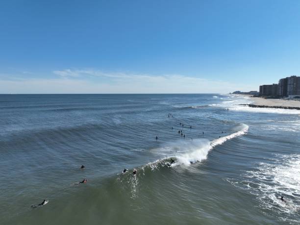 Surfing at the new jersey shore during dusk and during the day