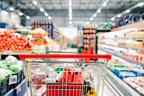 Shopping cart in grocery store stock photo