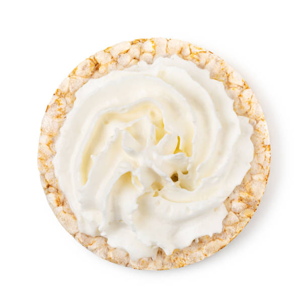 istock Rice cakes with cream cheese  top view isolated on white background 1455311532