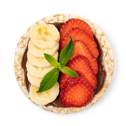 Rice cakes with chocolate paste, strawberry and banana  isolated on white background