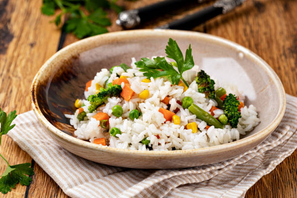 istock Bowl with tasty rice and vegetables 1455314590