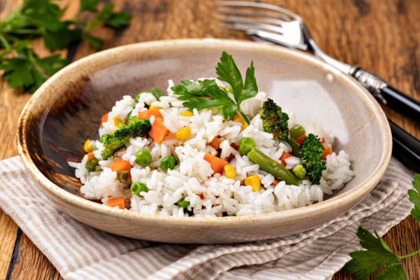 istock Bowl with tasty rice and vegetables 1455314605