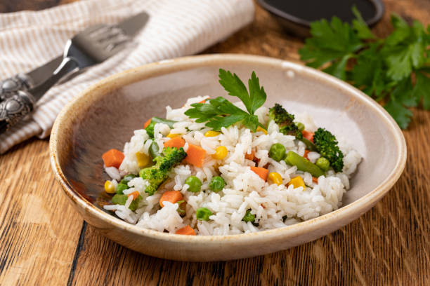 istock Bowl with tasty rice and vegetables 1455314612
