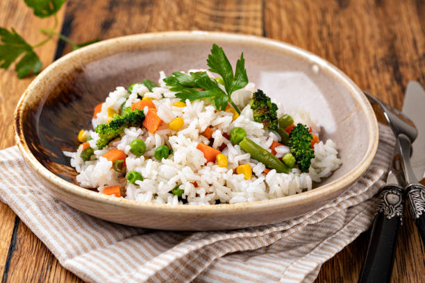istock Bowl with tasty rice and vegetables 1455314613