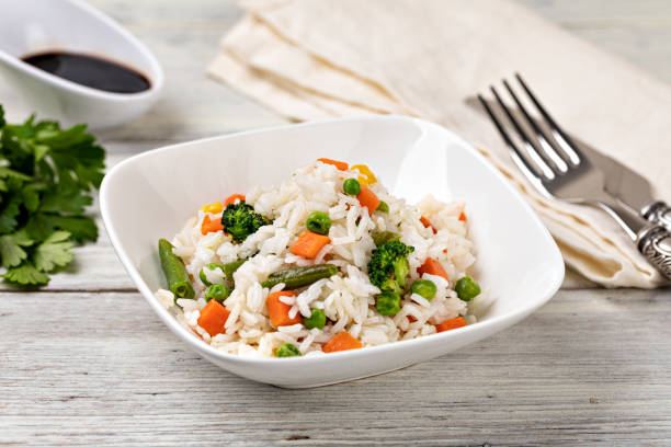 istock Bowl with tasty rice and vegetables 1455314667