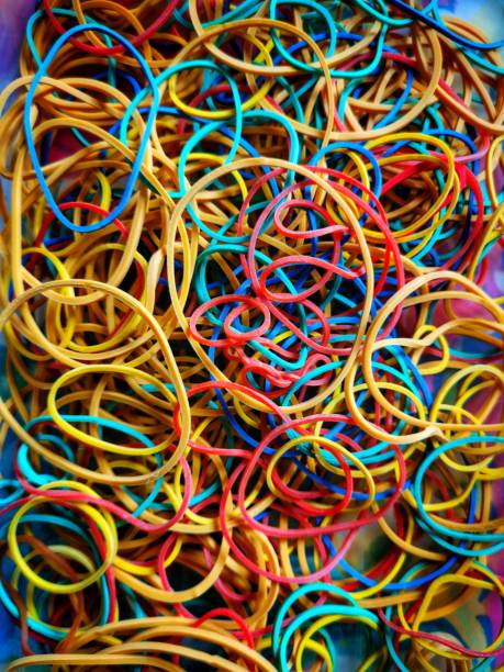 A vertical shot of colorful rubber bands