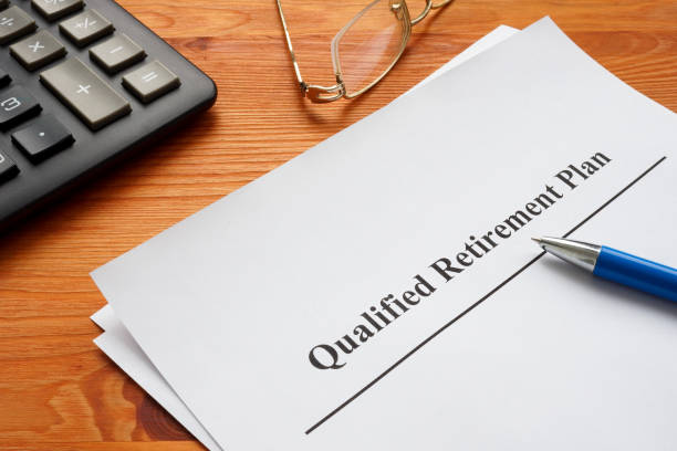 istock Qualified retirement plan, a calculator and glasses. 1455314981