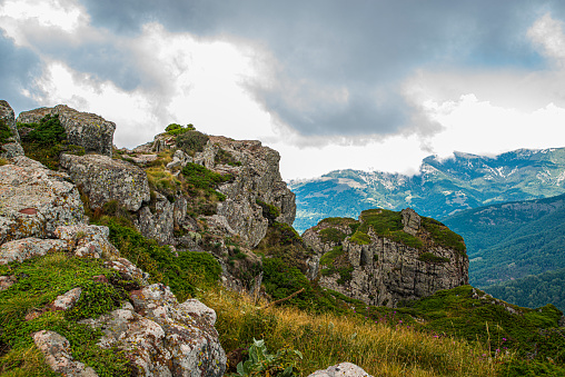View to cross on summit of mountain Hochlantsch and mountain Rennfeld in Styria, Austria