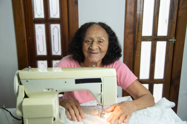 istock brazilian elderly woman using sewing machine 1455318713