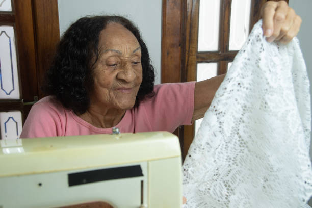 istock brazilian elderly woman using sewing machine 1455318726