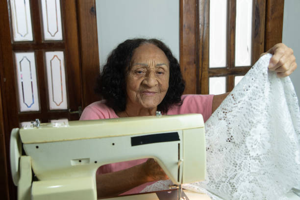 istock brazilian elderly woman using sewing machine 1455318729