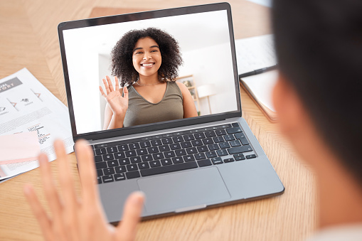 Business people, laptop and video call on screen with waving for online interview, recruitment or meeting. Woman, happy and welcome on internet seminar, webinar or workshop with video conference