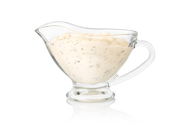 Bowl with tartar sauce isolated on white background