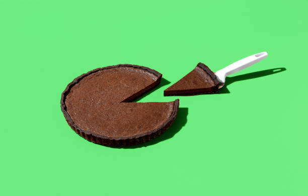 istock Chocolate tart isolated on a vibrant green background. 1455324828