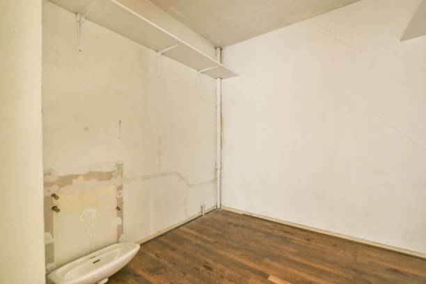 istock a bathroom with white walls and a toilet in it 1455325234