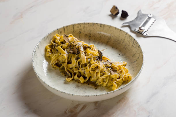 istock tagliatelli pasta with black truffle on marble table 1455325284