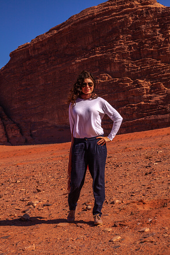 A Caucasian female poseing in Wadi Rum, Jordan