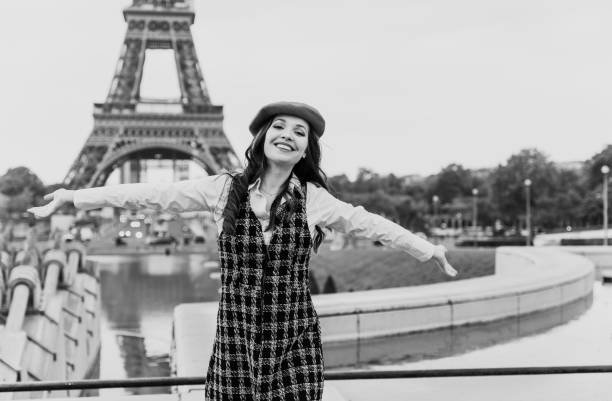 Energetic woman captured mid-jump, expressing freedom and happiness against an urban backdrop at sunset. Highlighting positivity and liveliness in a city environment