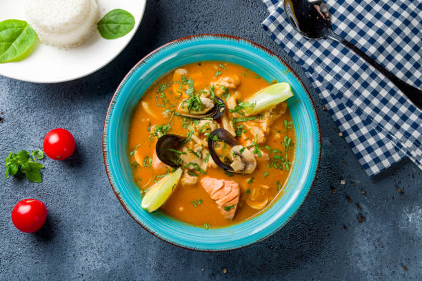 istock Tom Yam soup with seafood and salmon top view 1455325431