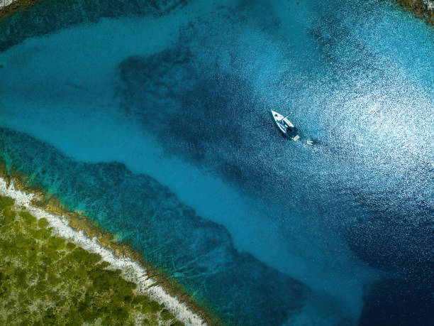istock Anchored sailboat, view from drone 1455326393
