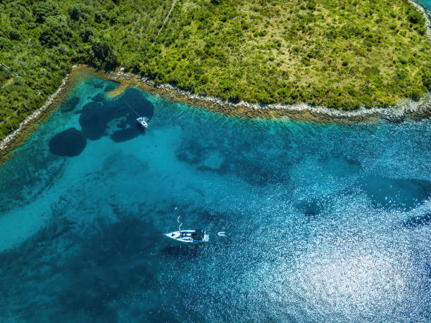 istock Anchored sailboat, view from drone 1455326407