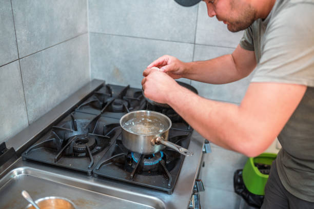 istock Patient Male Cook Preparing Boiled Eggs 1455326524