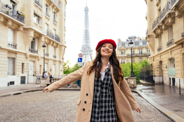 Beautiful young woman visiting paris and the eiffel tower stock photo