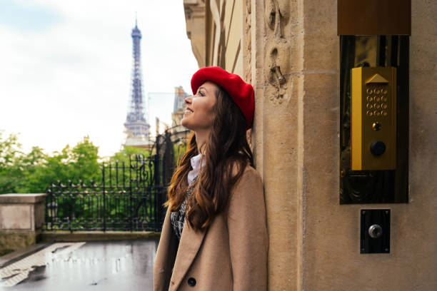 istock Beautiful young woman visiting paris and the eiffel tower 1455328330