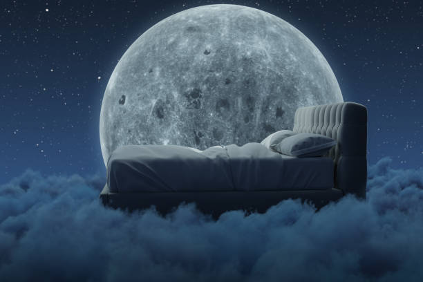istock 3d rendering of cozy bed over fluffy clouds at night. Illuminated by big moon 1455333587